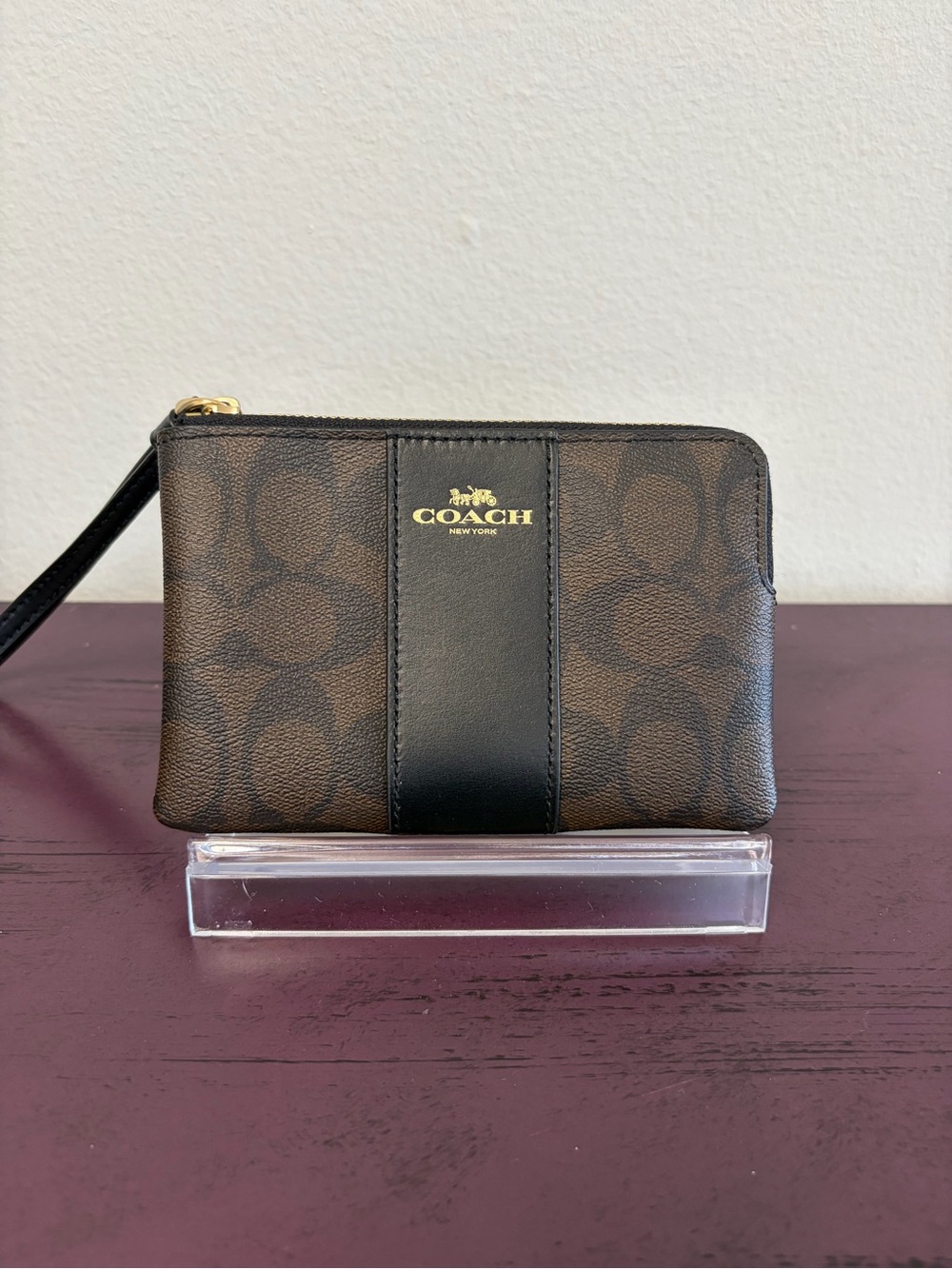 COACH Brown Signature Canvas Wristlet with Black Center Stripe and Gold Logo